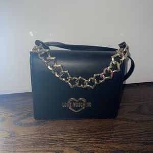 Moschino black crossbody bag. Work a few times but in great condition
